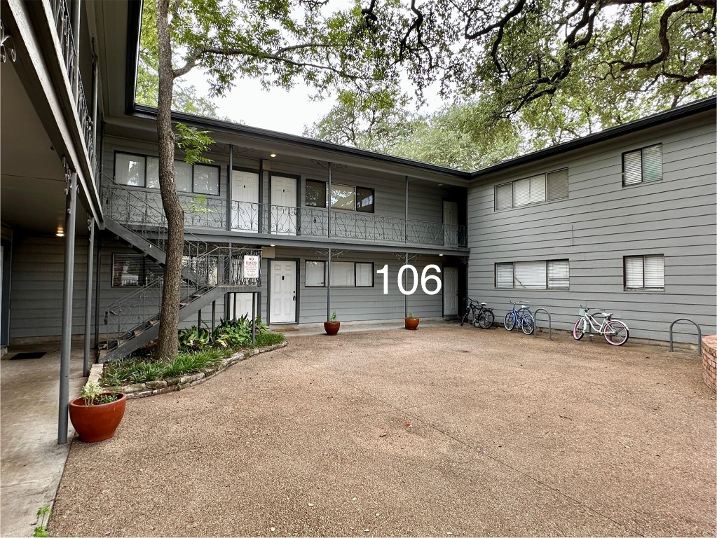 803 West 28th Street, Unit 106 Austin, TX 78705 - Photo 18 of 20 a front view of a house with yard