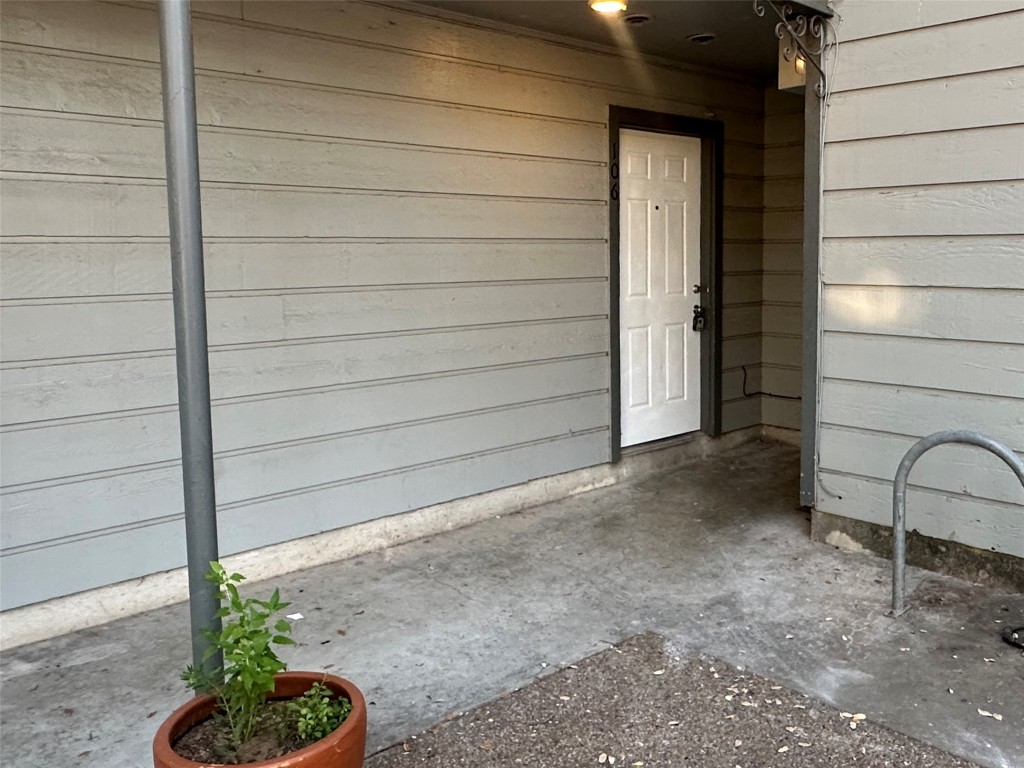 803 West 28th Street, Unit 106 Austin, TX 78705 - Photo 2 of 20 a view of a house with a backyard and wooden fence