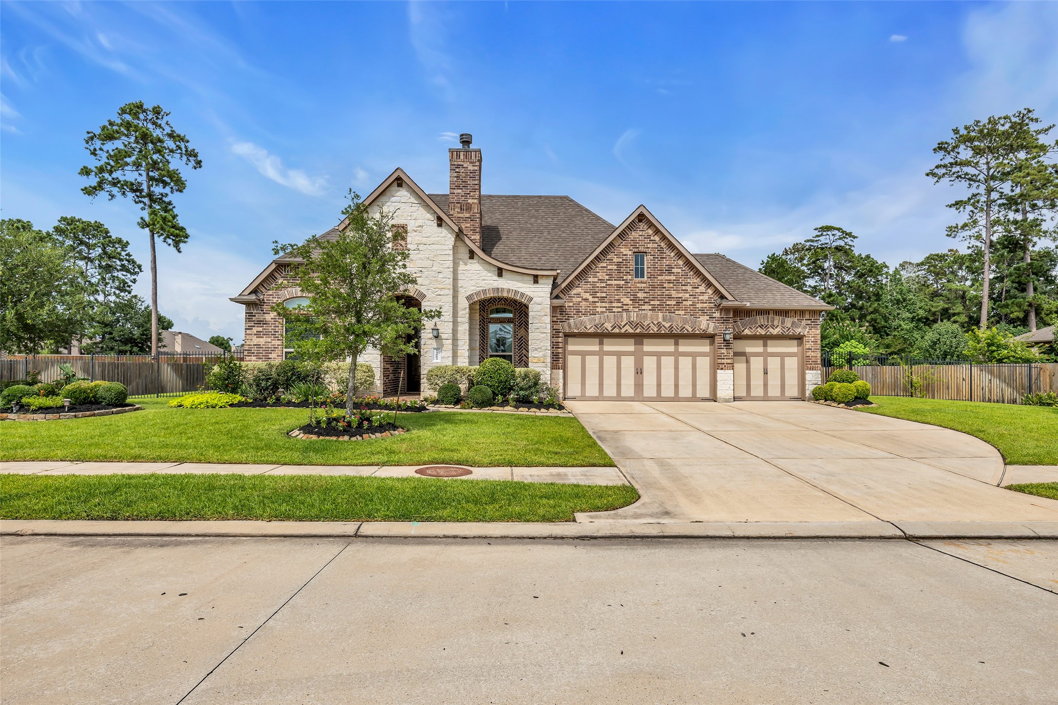 14003 South Evergreen Ridge Court Conroe, TX 77384 - Photo 40 of 43 Generous 135' wide lot provides additional space around the home, enhancing both curb appeal and privacy.