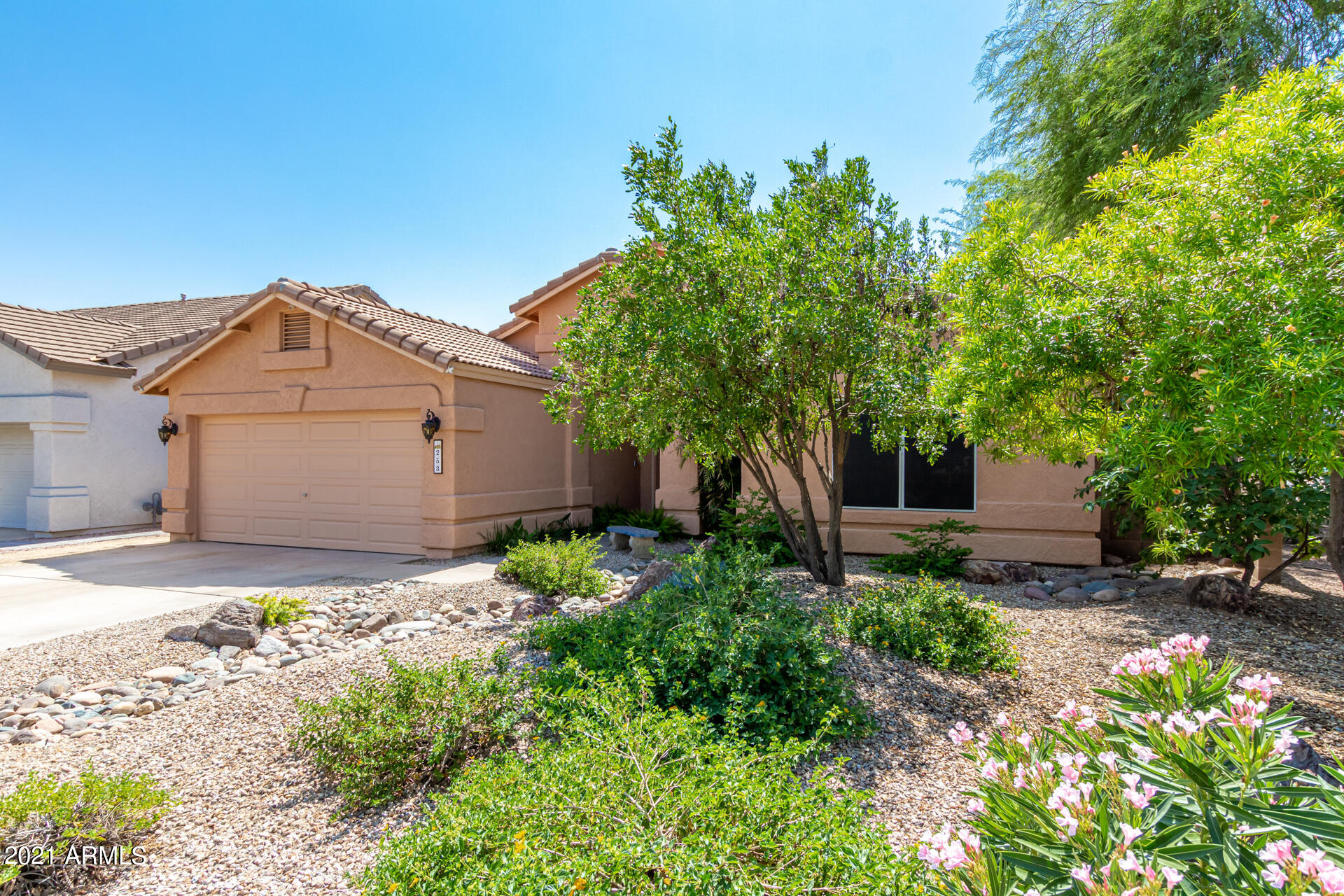 253 East Nunneley Road Gilbert, AZ 85296 - Photo 3 of 25 a front view of a house with garden