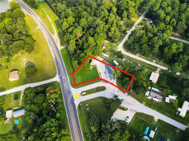 a view of swimming pool with a garden and plants