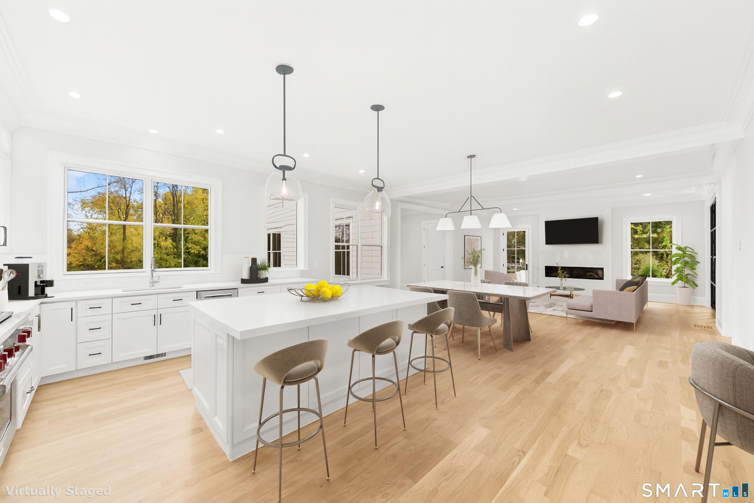 119 Harrison Avenue New Canaan, CT 06840 - Photo 13 of 40 a kitchen with a sink a stove and chairs