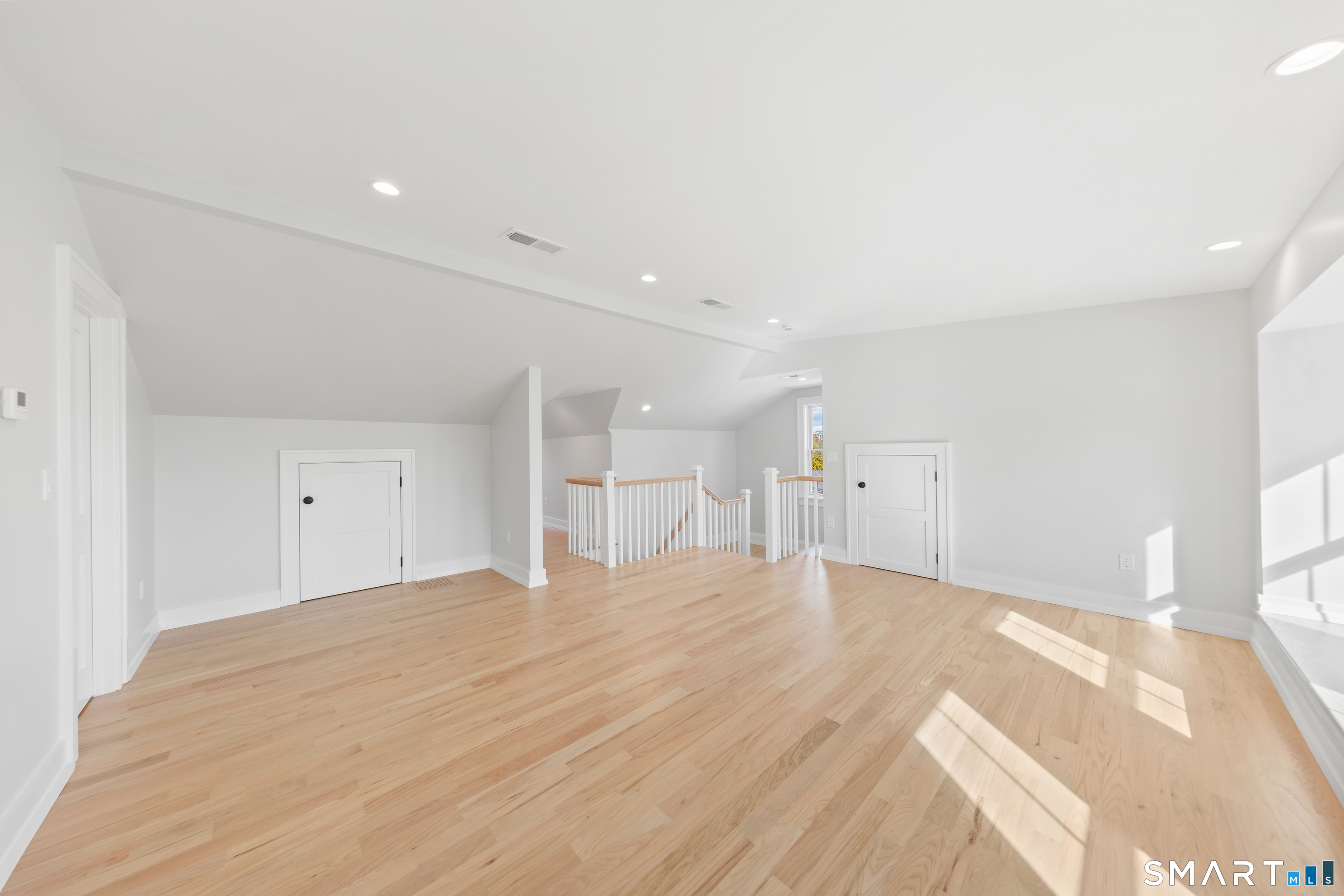 119 Harrison Avenue New Canaan, CT 06840 - Photo 29 of 40 a view of empty room with wooden floor