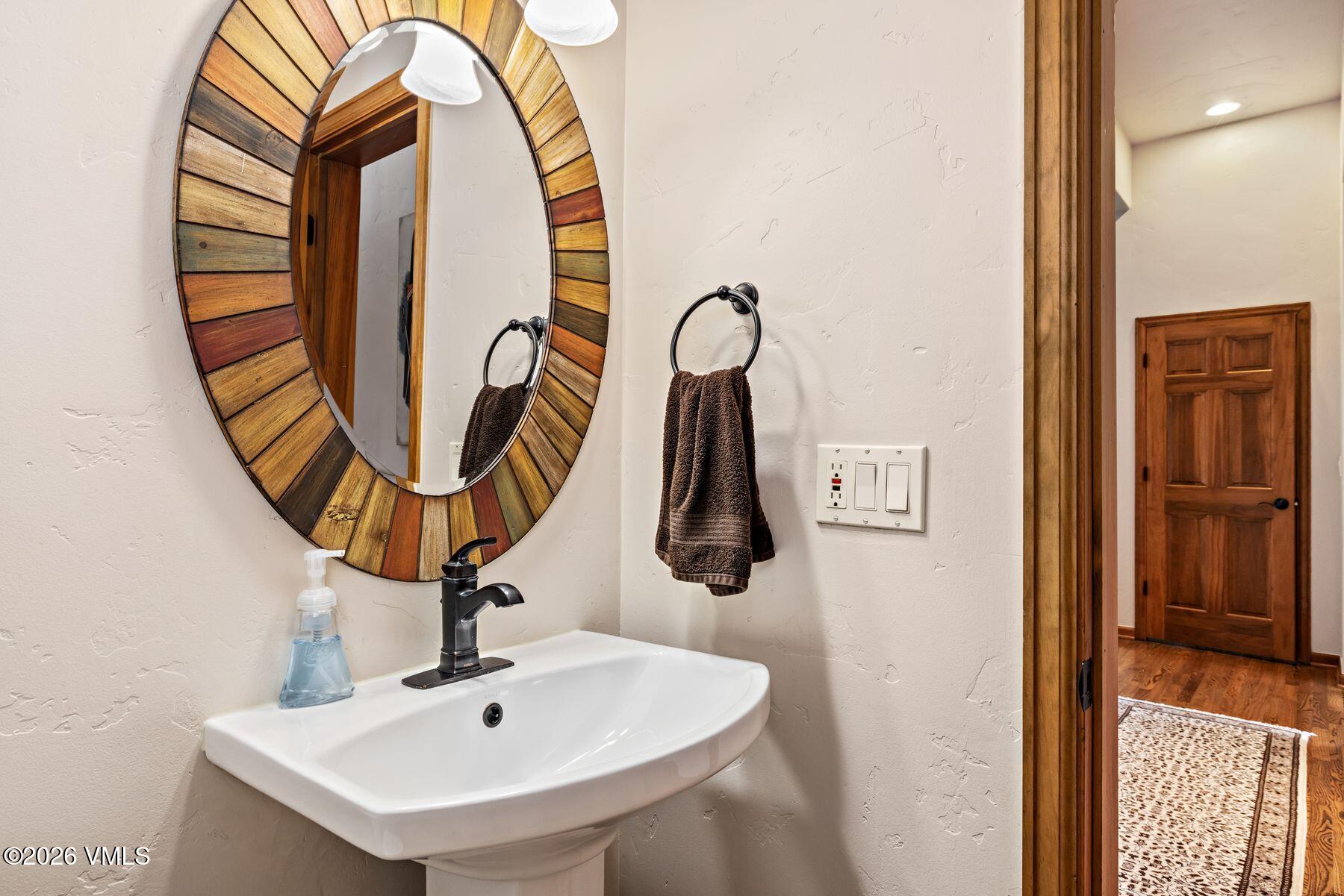 91 Creamery Trail Edwards, CO 81632 - Photo 27 of 44 a bathroom with a sink and a mirror