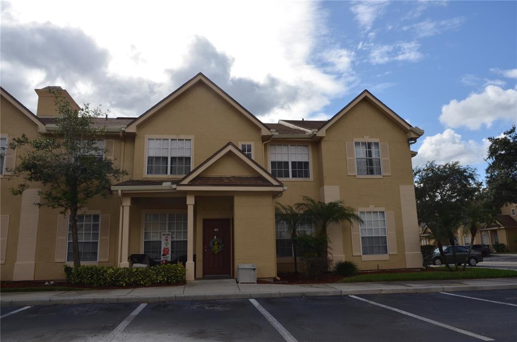 842 Grand Regency Pointe, Unit 203 Altamonte Springs, FL 32714 - Photo 1 of 1 a front view of a house with a yard