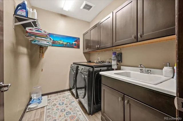 a bathroom with a sink toilet and a mirror