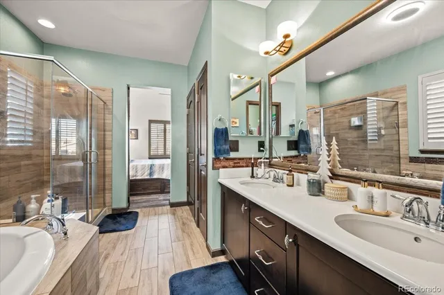 a bedroom with bed and a large window