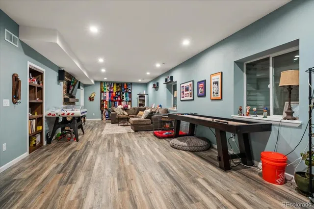 a view of a roof deck with table and chairs