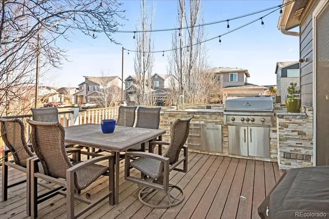 a view of a patio with iron fence