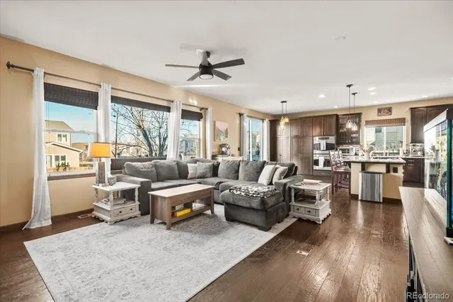 a view of a living room with furniture and a flat screen tv
