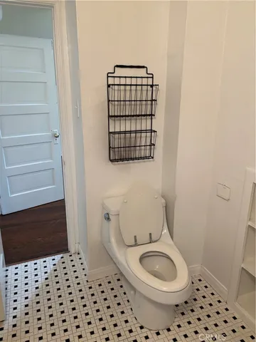 a bathroom with a toilet a sink and a shower