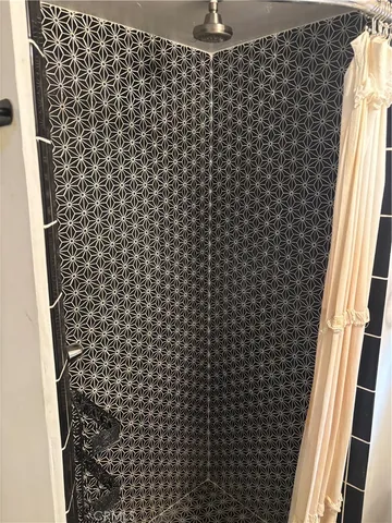 a bathroom with a shower curtain