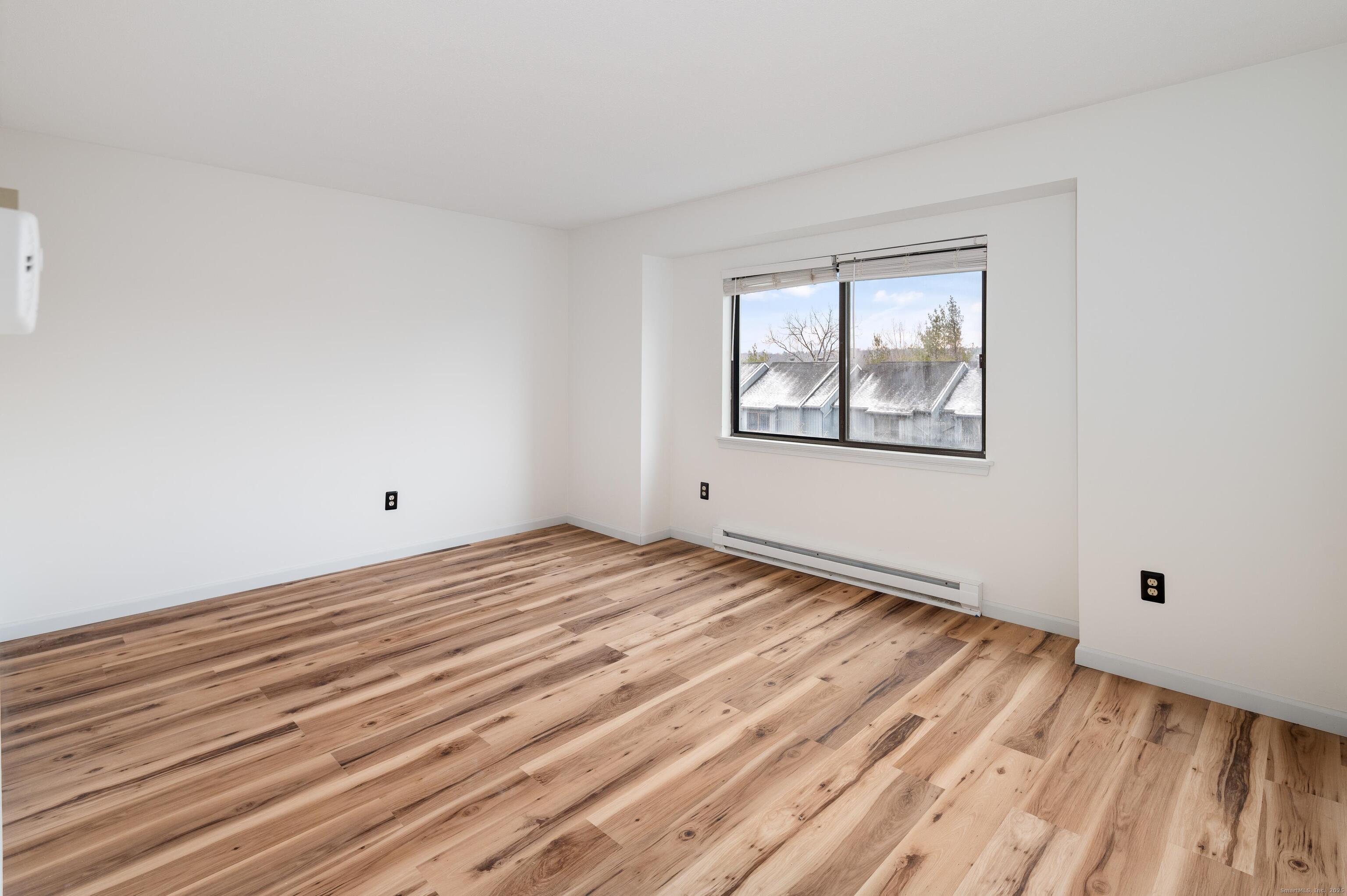 8 Driftway Road, Unit C1 Danbury, CT 06811 - Photo 11 of 23 a view of empty room with wooden floor
