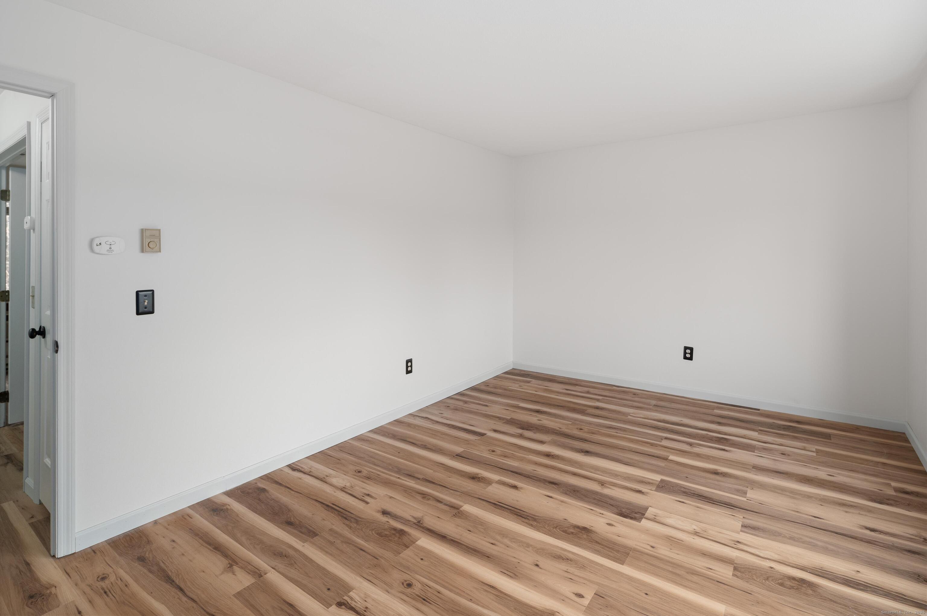 8 Driftway Road, Unit C1 Danbury, CT 06811 - Photo 12 of 23 a view of a room with wooden floor and bathroom