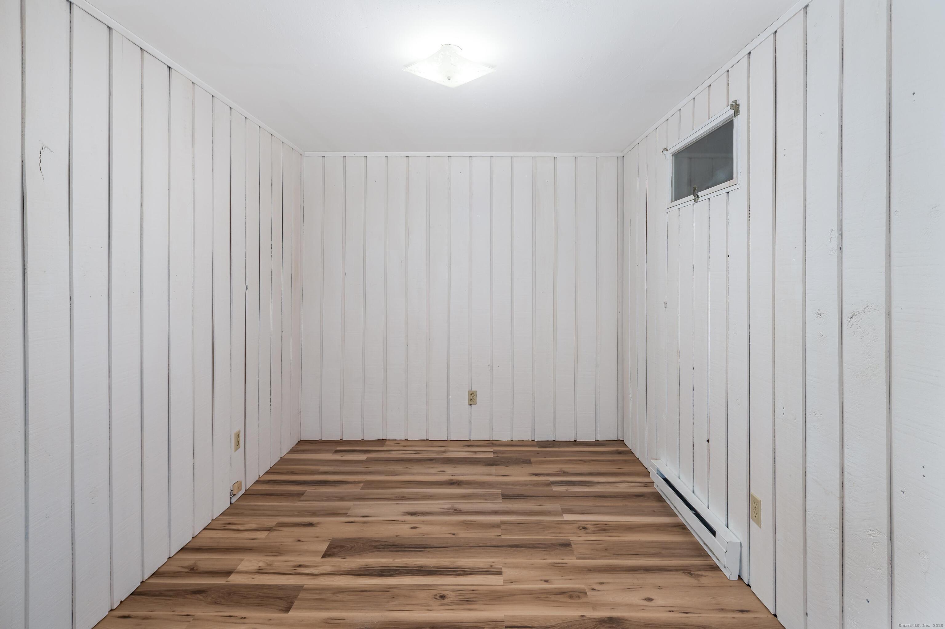 8 Driftway Road, Unit C1 Danbury, CT 06811 - Photo 21 of 23 a view of a hallway with wooden floor and stairs