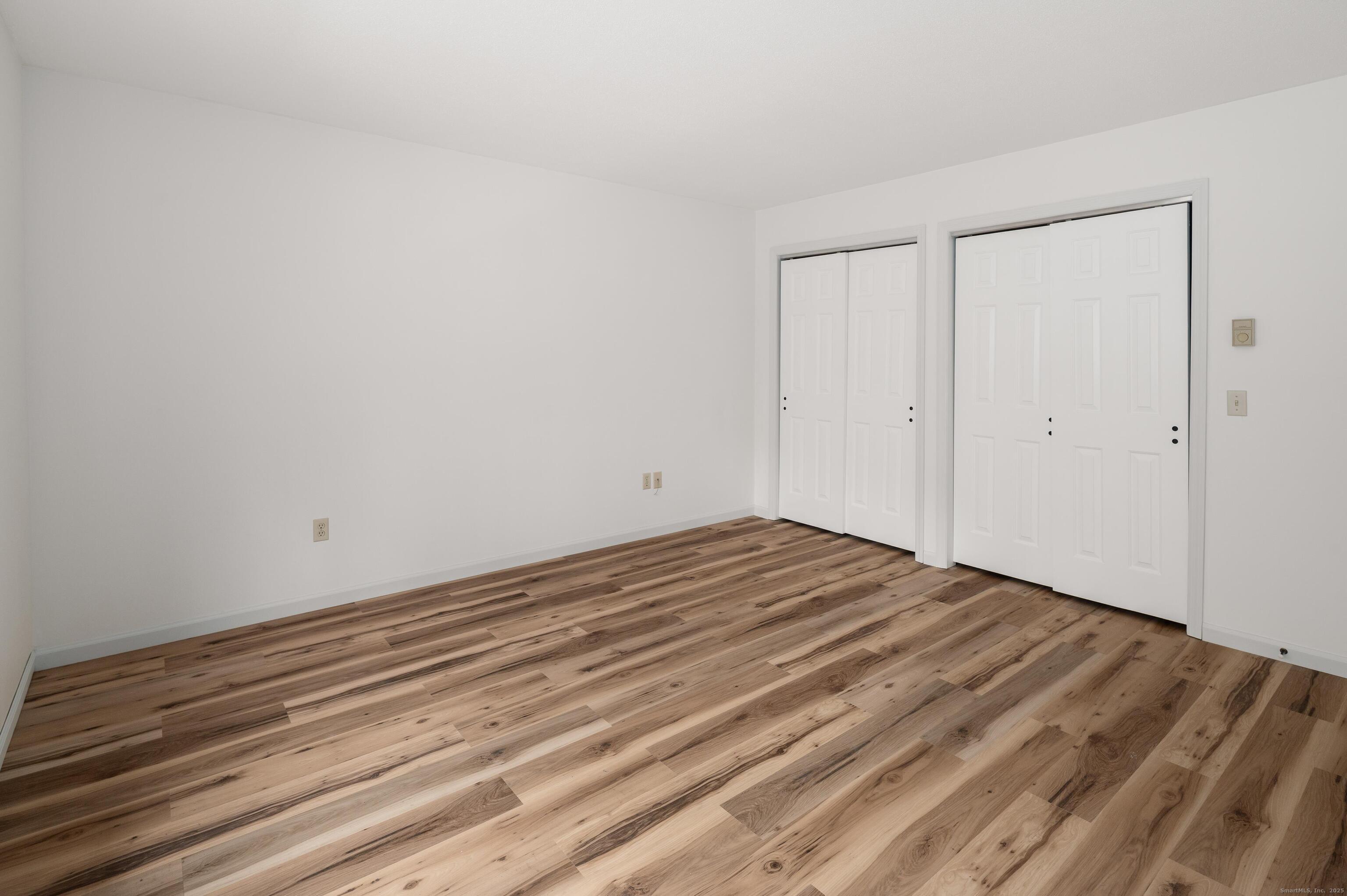 8 Driftway Road, Unit C1 Danbury, CT 06811 - Photo 9 of 23 a view of empty room with wooden floor