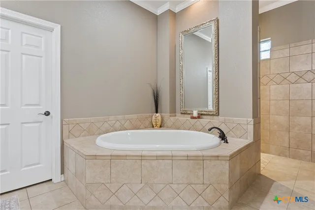 a white bath tub sitting in a bathroom