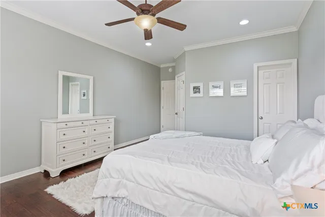 a bedroom with a bed and a dresser