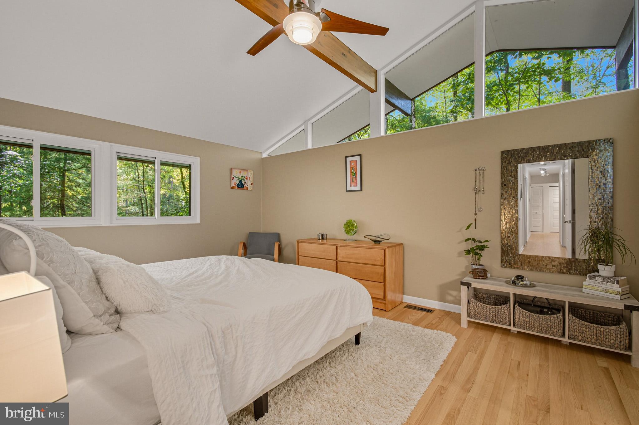 7145 Deer Valley Road Highland, MD 20777 - Photo 21 of 75 a bedroom with a bed couch and a window
