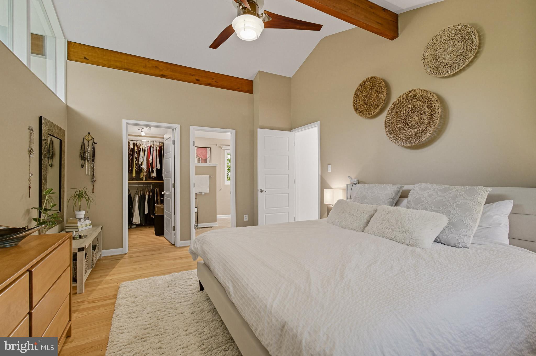 7145 Deer Valley Road Highland, MD 20777 - Photo 23 of 75 a bedroom with a bed and a chandelier