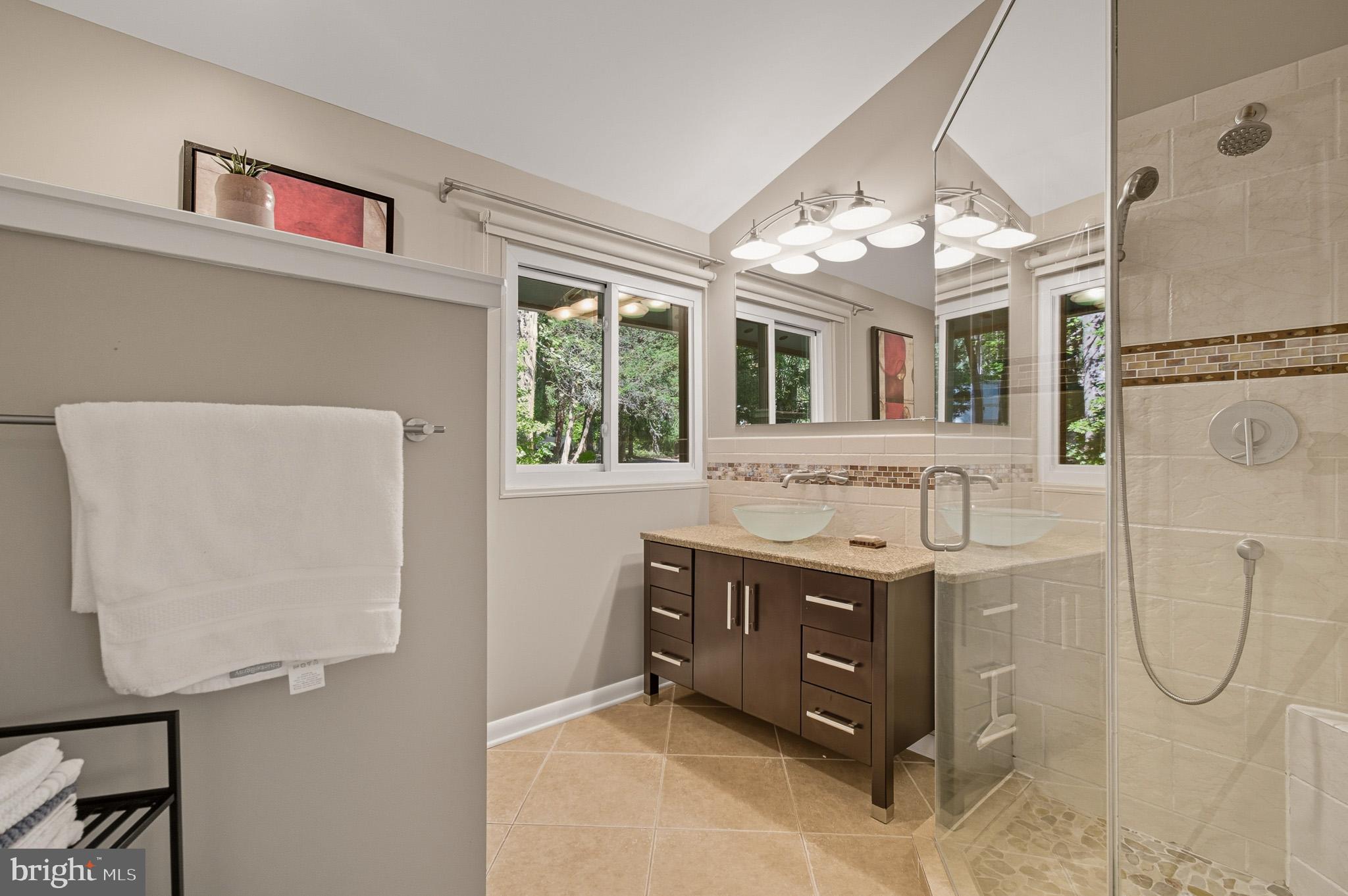 7145 Deer Valley Road Highland, MD 20777 - Photo 31 of 75 a bathroom with a granite countertop sink and a mirror
