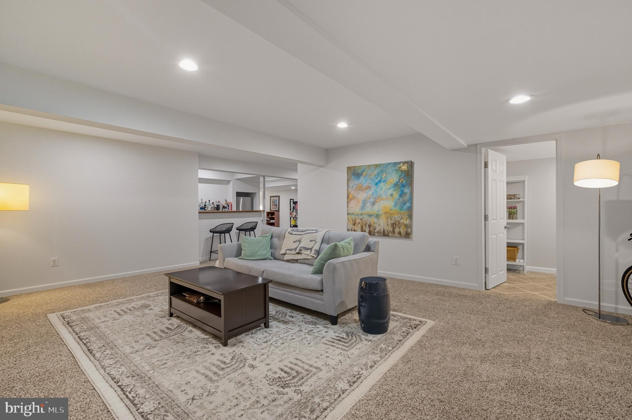 7145 Deer Valley Road Highland, MD 20777 - Photo 32 of 75 a living room with furniture and a rug