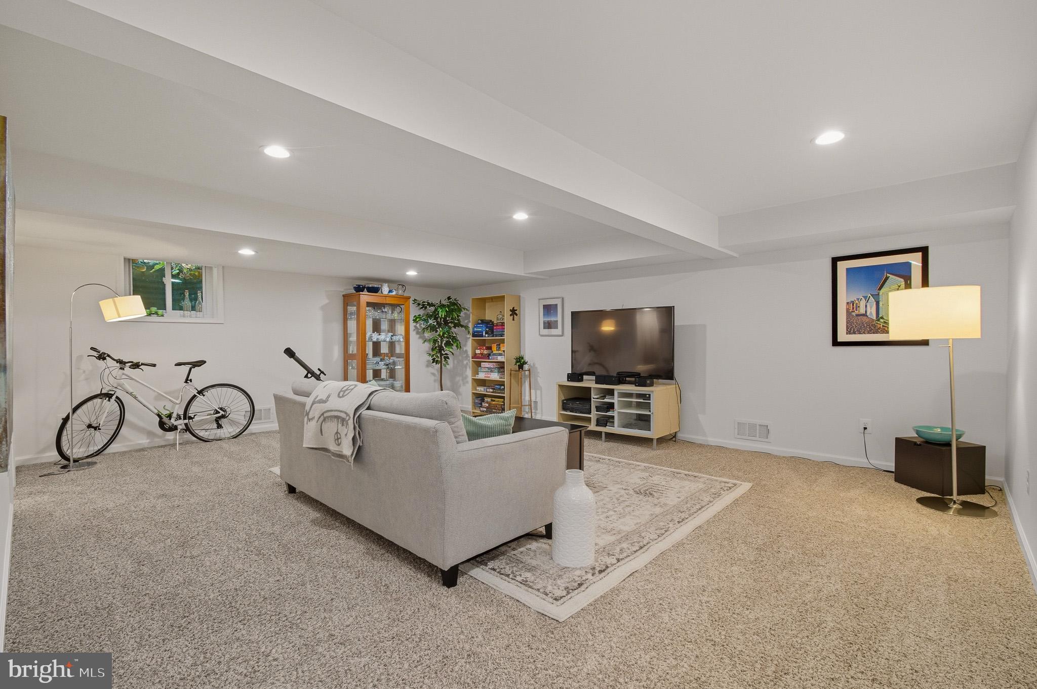 7145 Deer Valley Road Highland, MD 20777 - Photo 33 of 75 a living room with furniture and a flat screen tv