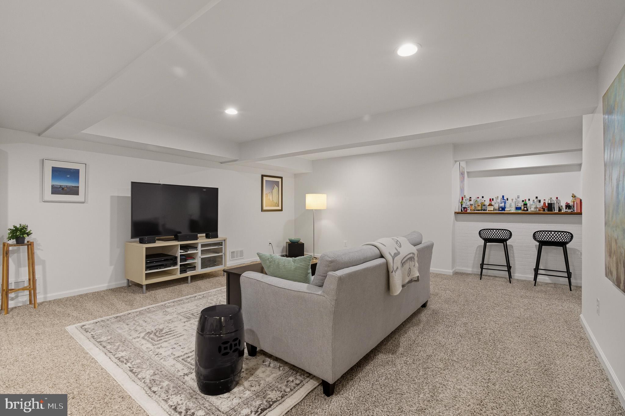 7145 Deer Valley Road Highland, MD 20777 - Photo 35 of 75 a living room with furniture and a flat screen tv