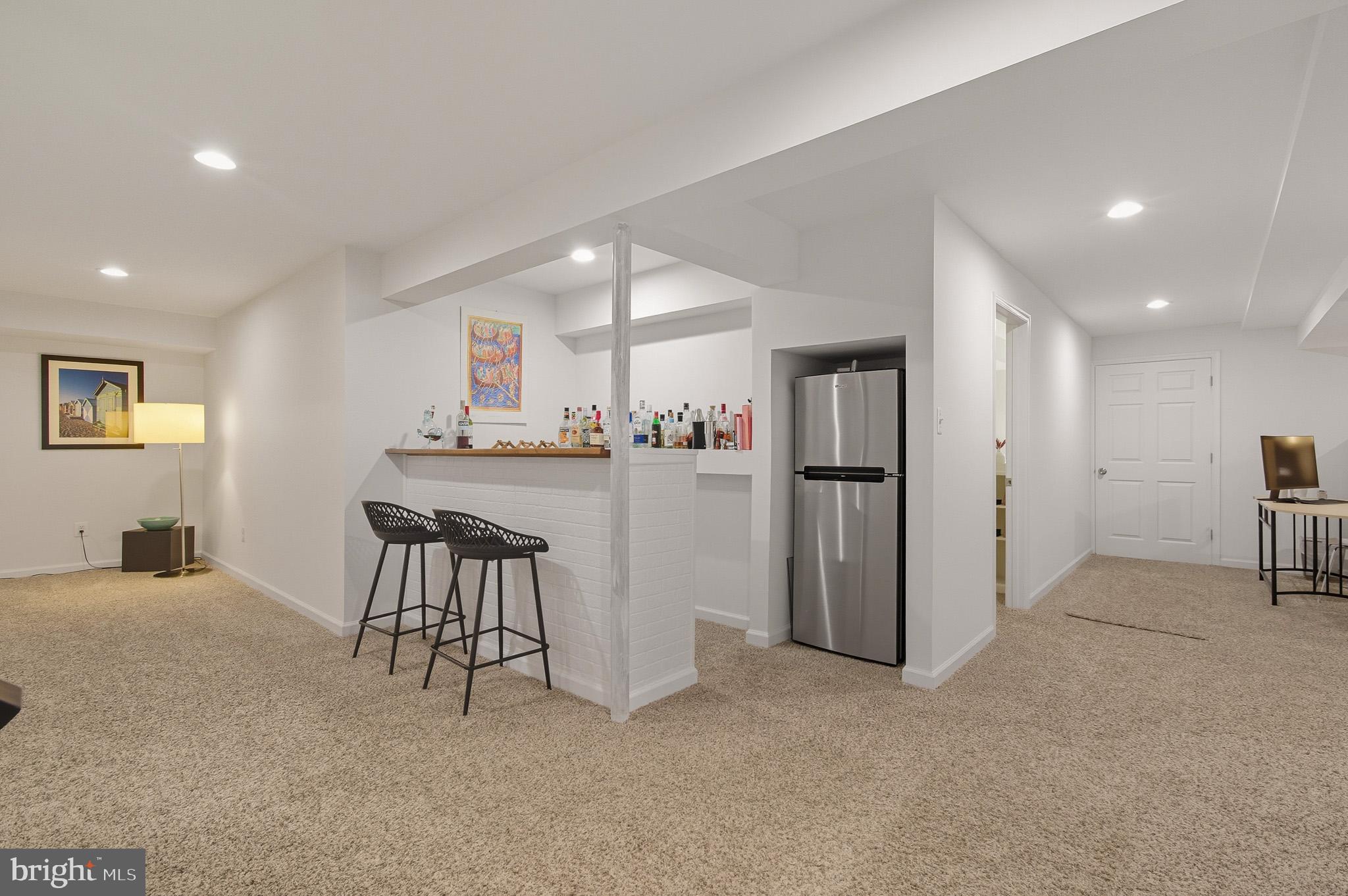 7145 Deer Valley Road Highland, MD 20777 - Photo 36 of 75 a view of a kitchen with refrigerator and a counter top space