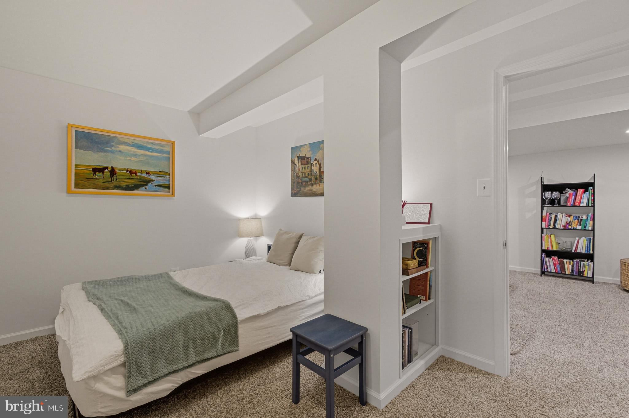 7145 Deer Valley Road Highland, MD 20777 - Photo 43 of 75 a bedroom with a bed and a book shelf