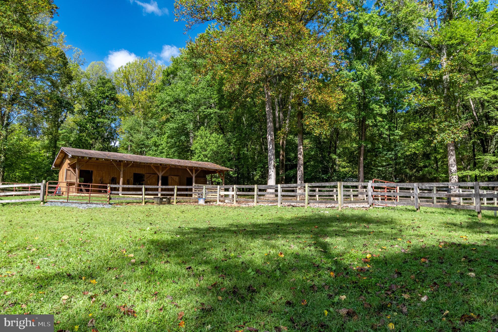 7145 Deer Valley Road Highland, MD 20777 - Photo 54 of 75 a backyard of a house with table and chairs