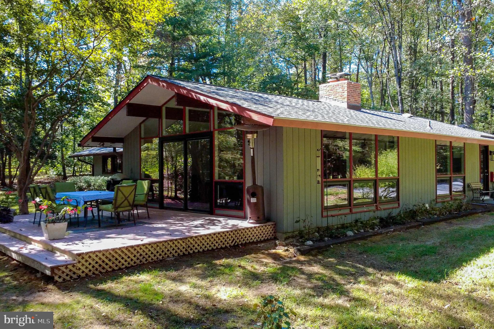 7145 Deer Valley Road Highland, MD 20777 - Photo 62 of 75 a view of a house with backyard porch and sitting area