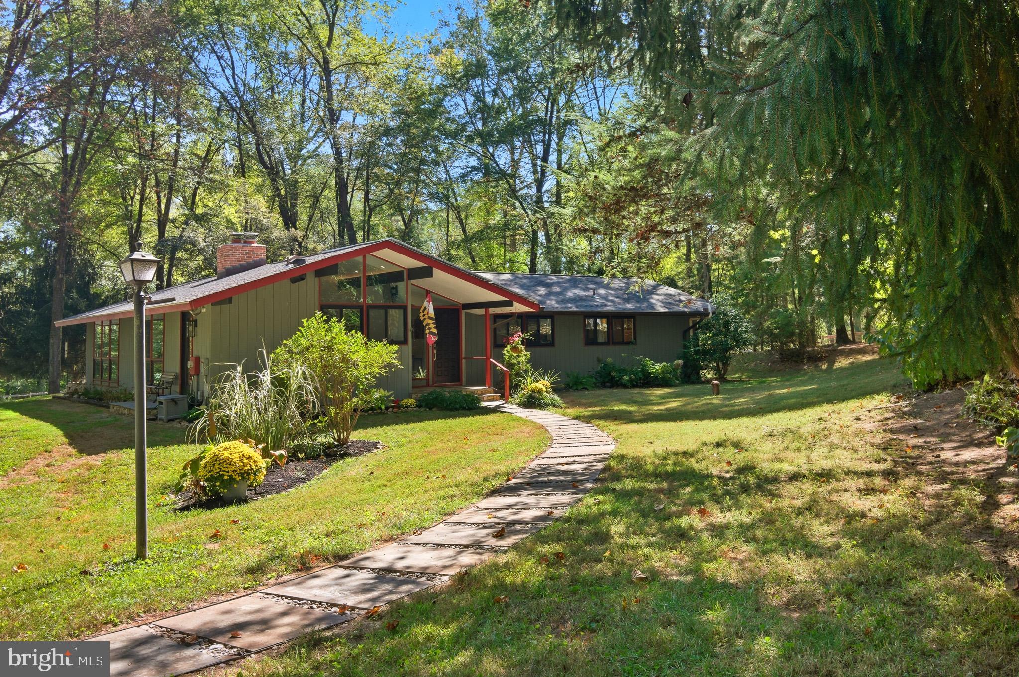 7145 Deer Valley Road Highland, MD 20777 - Photo 66 of 75 a front view of a house with a yard
