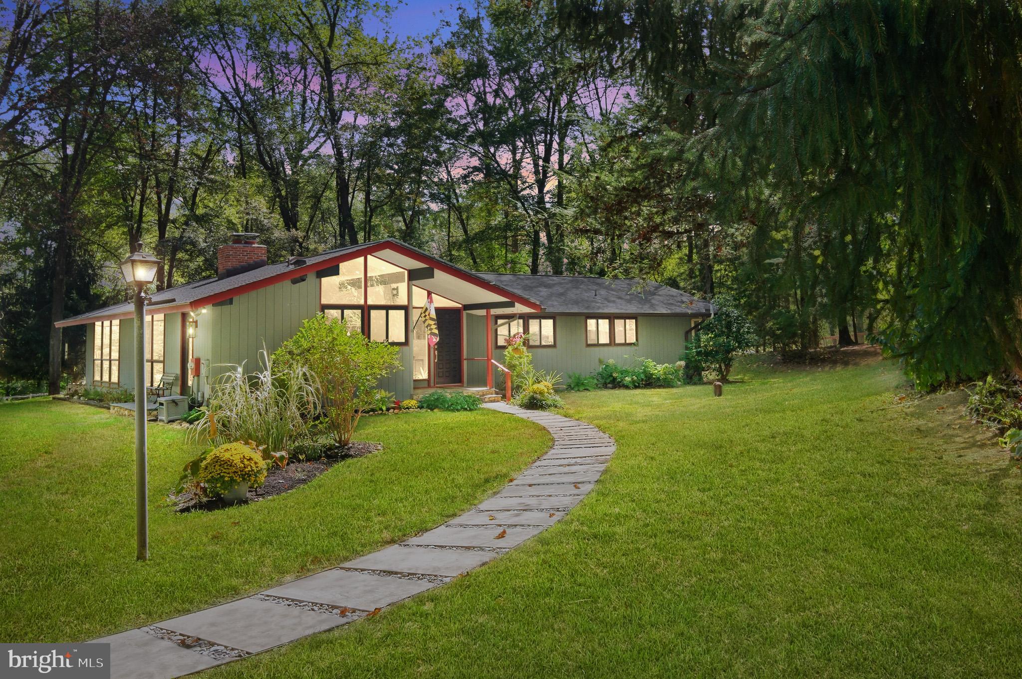 7145 Deer Valley Road Highland, MD 20777 - Photo 72 of 75 a front view of a house with a yard and porch