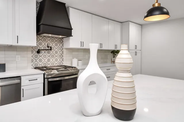 a kitchen with a sink and cabinets