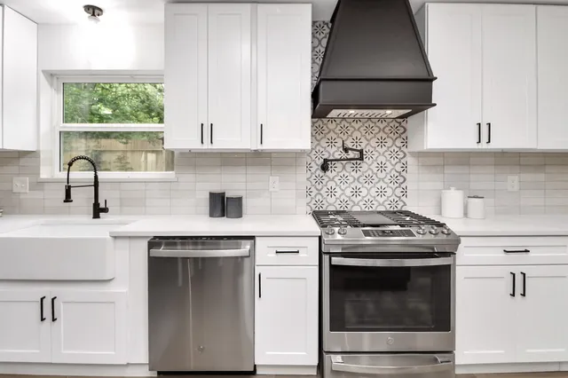 a kitchen with a refrigerator and a sink