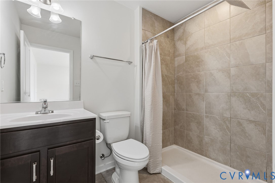 1925 Kennington Park Road Aylett, VA 23009 - Photo 19 of 32 a bathroom with a granite countertop sink toilet and a mirror