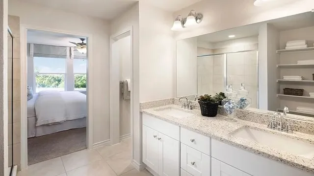 a view of a workspace with furniture and window