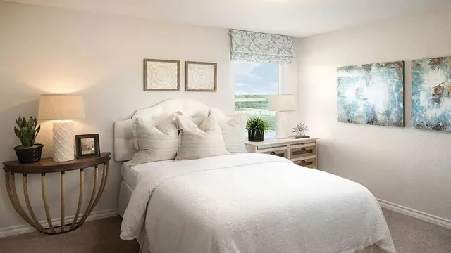 a kitchen with a sink a counter top space a large window and stainless steel appliances