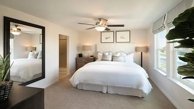 a en suite bathroom with double sink and a mirror
