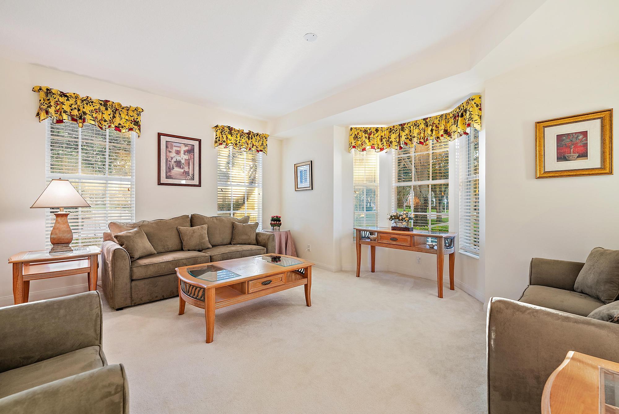 277 New Haven Boulevard Jupiter, FL 33458 - Photo 15 of 36 a living room with furniture and a window
