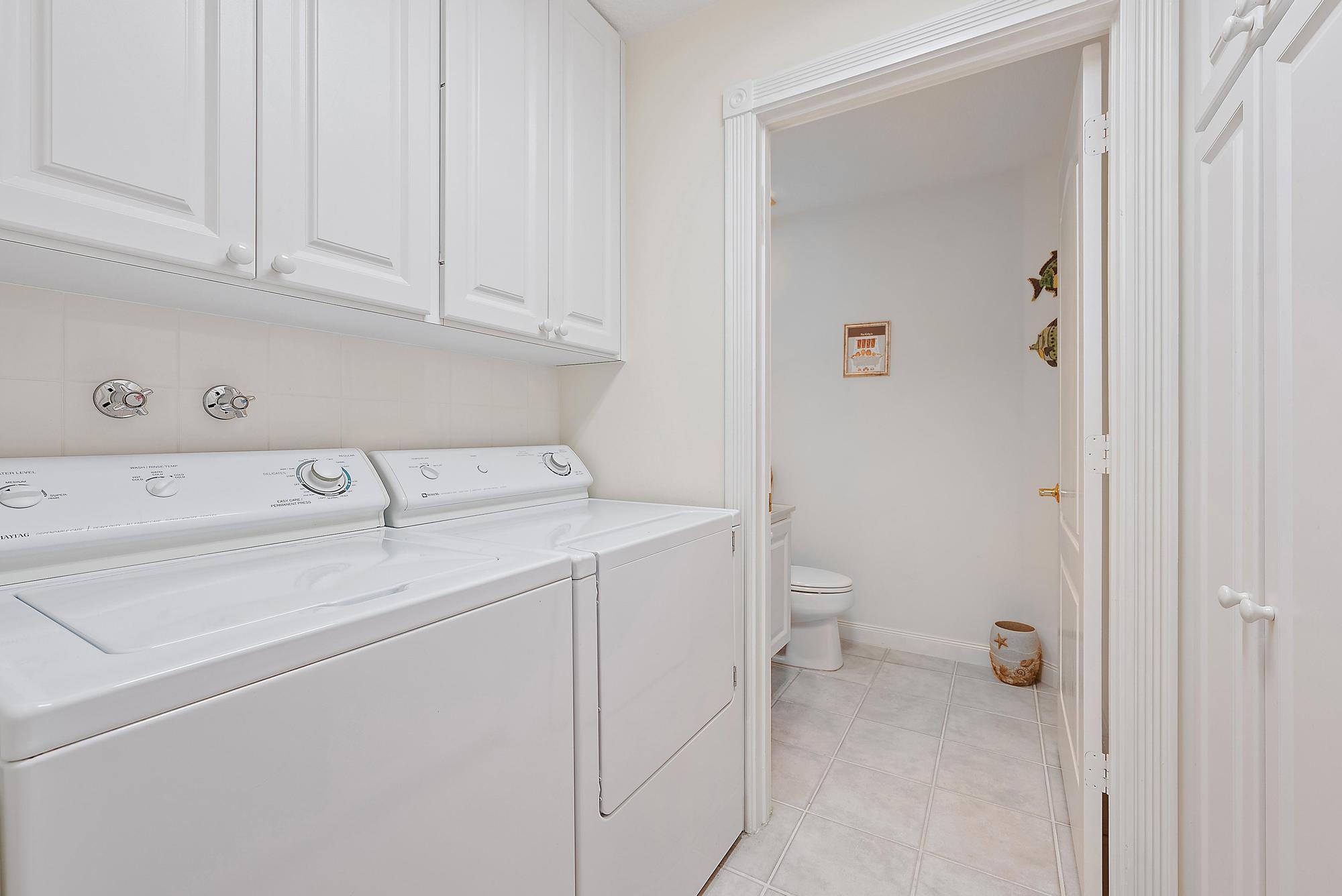 277 New Haven Boulevard Jupiter, FL 33458 - Photo 25 of 36 a utility room with dryer and washer
