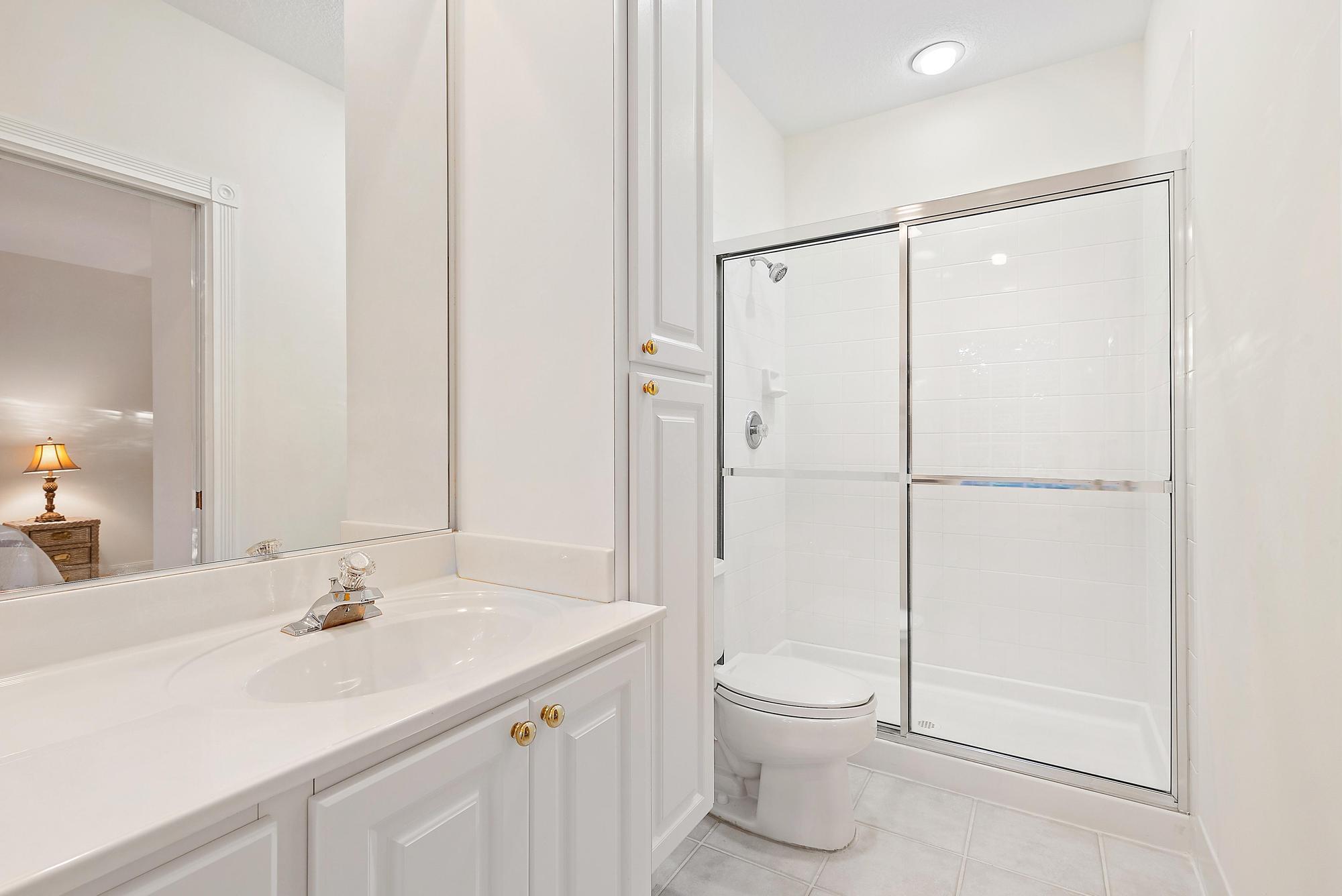 277 New Haven Boulevard Jupiter, FL 33458 - Photo 31 of 36 a bathroom with a sink a toilet and shower