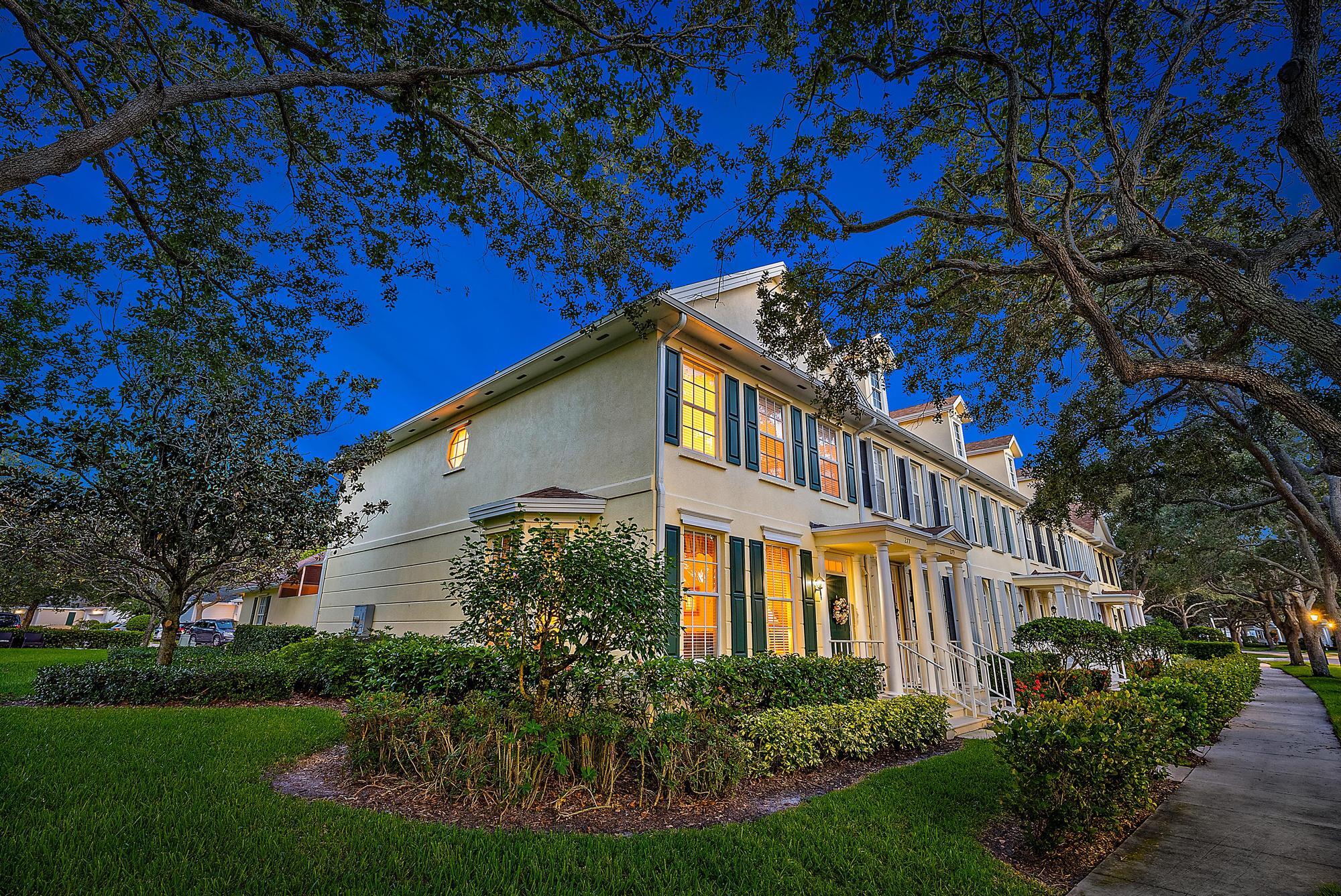 277 New Haven Boulevard Jupiter, FL 33458 - Photo 4 of 36 a front view of a house with a yard