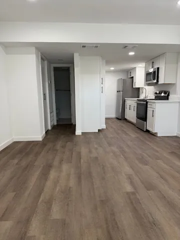 a view of a kitchen with a sink