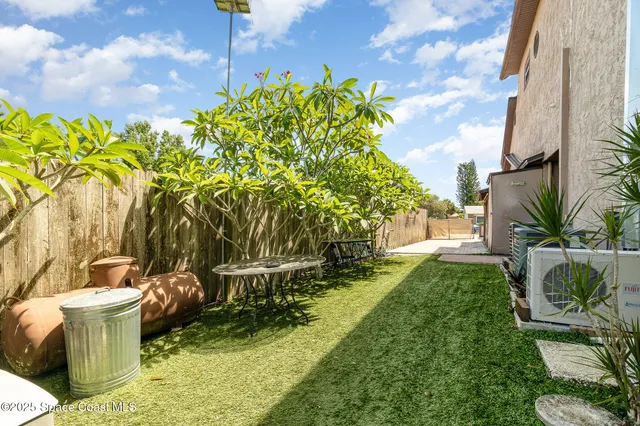 a view of backyard of a house