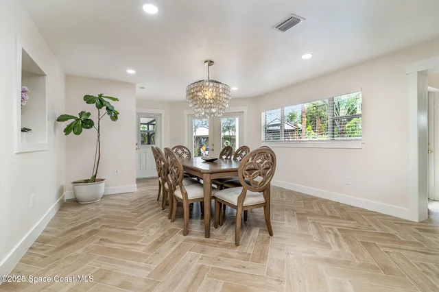 a view of a dining room with furniture and window