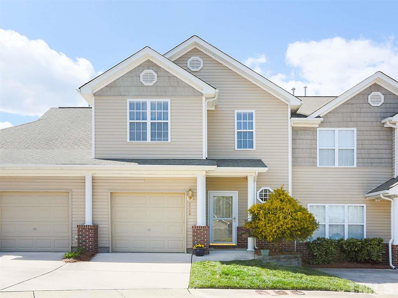 2708 Andover Glen Road Raleigh, NC 27604 - Photo 2 of 25 a front view of a house with a yard and garage