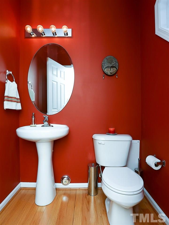 2708 Andover Glen Road Raleigh, NC 27604 - Photo 12 of 25 a bathroom with a toilet sink and mirror