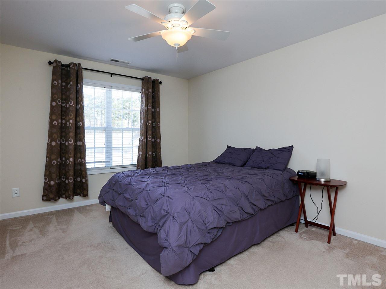 2708 Andover Glen Road Raleigh, NC 27604 - Photo 13 of 25 a spacious bedroom with a bed and a window